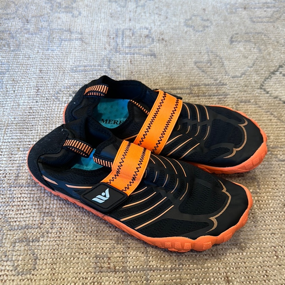 Black and Orange Water Shoes with Durable Straps and Cushioned Sole